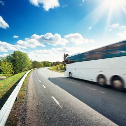 Bus on asphalt road in beautiful spring day